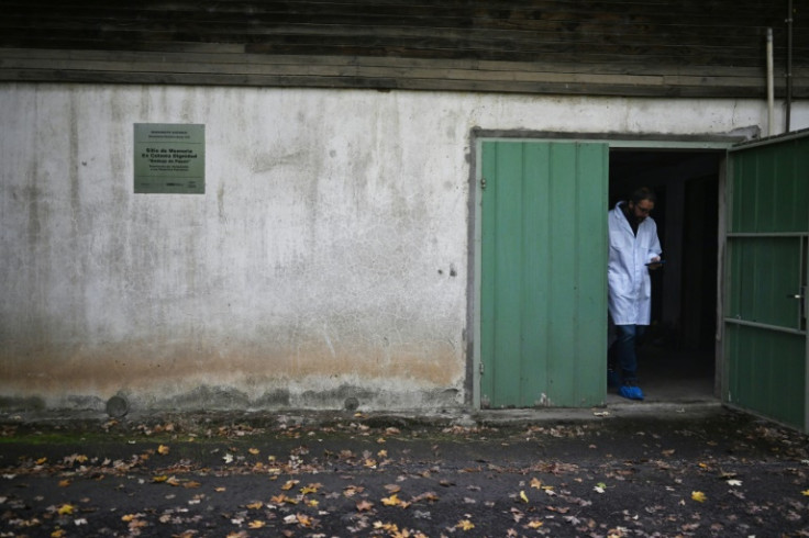 A man stands in the doorway of Villa Baviera's potato shed, which was used as a torture cell where Chilean agents abused dissidents and other people kidnapped during the 1973-1990 dictatorship of Augusto Pinochet