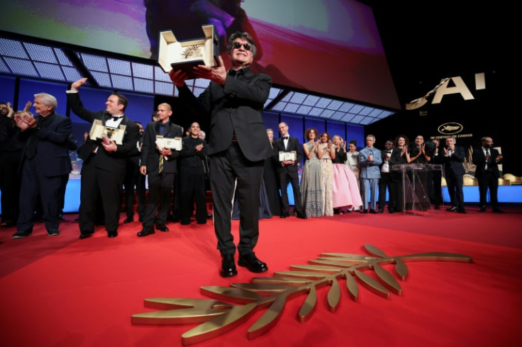 Iranian director Jafar Panahi celebrates winning the Palme d'Or at Cannes