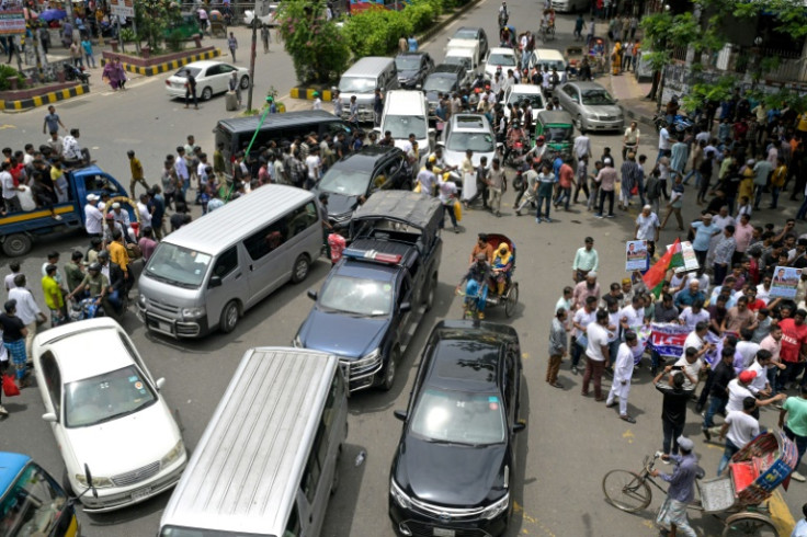 While tens of thousands gather at major intersections across Dhaka with their demands, others spend hours navigating their way through traffic-snarled streets