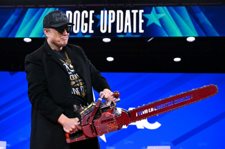 He brandished a chainsaw in reference to the cuts he is making to US federal services