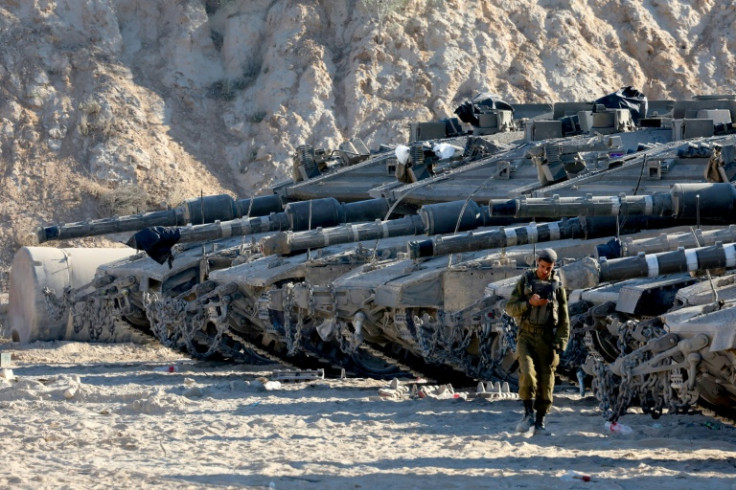 Israeli tanks take position on the Gaza border amid calls from a far-right minister to use "full force" in the battered territory.