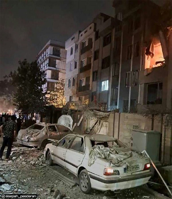 This handout photo released by Iran's Revolutionary Guard Corps (IRGC) official Sepah News Telegram channel on June 13, 2025 reportedly shows a building in Tehran hit in an Israeli strike