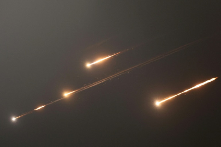 Rocket trails light up the skies over Jerusalem as Iran launches waves of missiles at Israel in response to its strikes on key nuclear and military facilities.