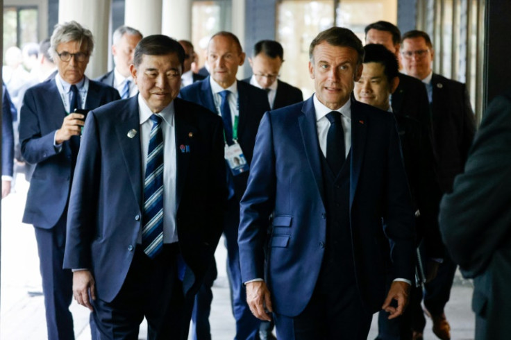 Japanese Prime Minister Shigeru Ishiba and French President Emmanuel Macron arrive for a working session on Ukraine during the Group of Seven summit in Kananaskis, Alberta, Canada