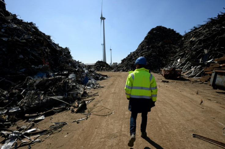 Ships are broken down into 50 recyclable materials at Belgium's Galloo, with a windmill generating its power