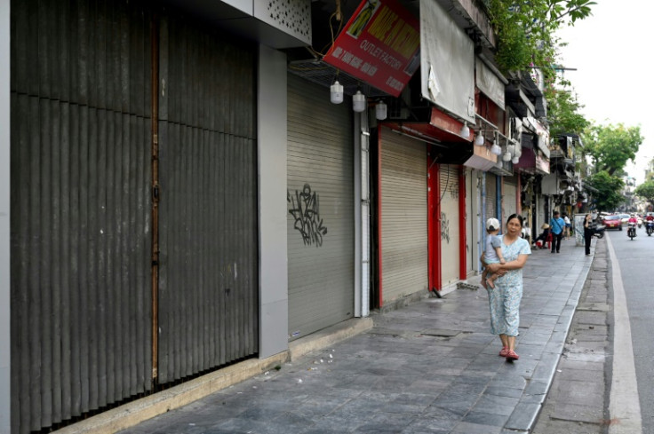 Shuttered shops now line Hanoi's streets and clothes stalls have closed at Saigon Square shopping mall