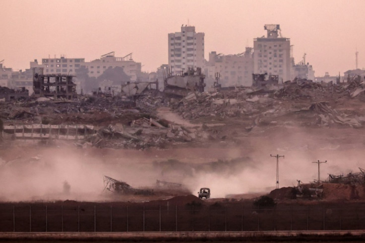 An Israeli military vehicle returning from the Gaza Strip into Israel