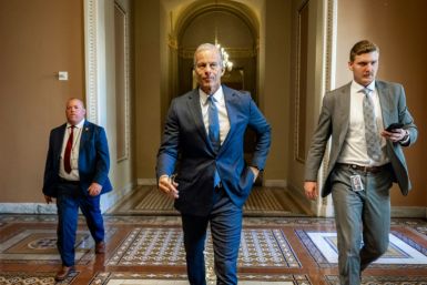 US Senate Majority Leader John Thune, Republican from South Dakota, walks to the Senate floor during debate on a massive tax cut and spending bill, a top priority of President Donald Trump
