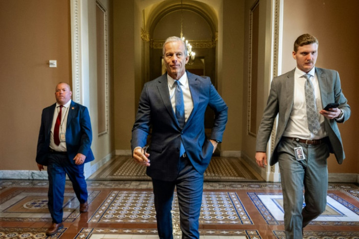US Senate Majority Leader John Thune, Republican from South Dakota, walks to the Senate floor during debate on a massive tax cut and spending bill, a top priority of President Donald Trump