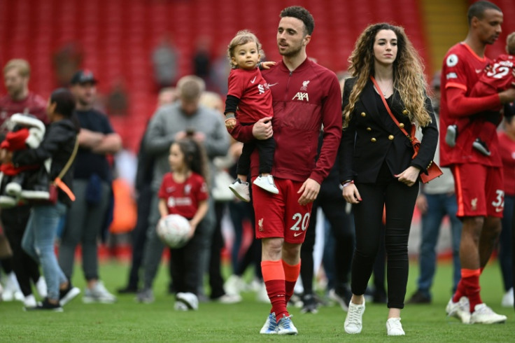 Diogo Jota celebrates with his family during a lap of honour at Anfield on May 22, 2022