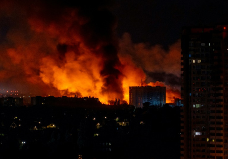 Flames and smoke billow from buildings during a mass Russian drones and missile strike on the Ukraine's capital