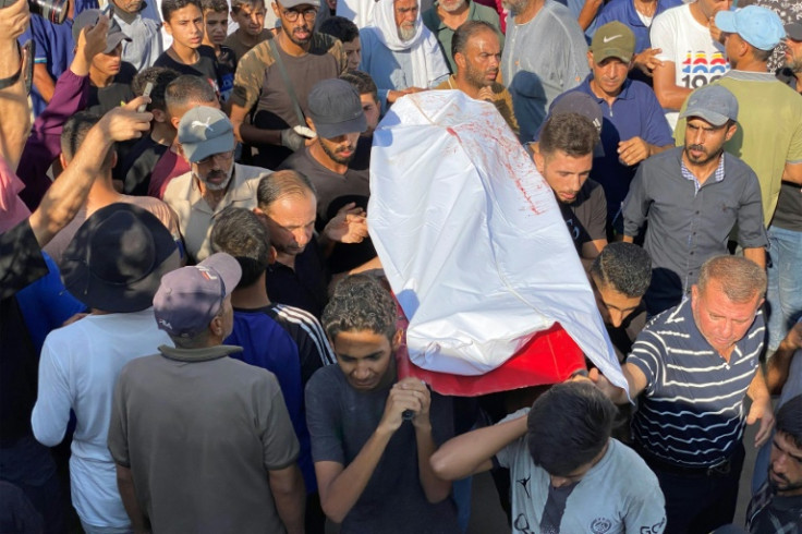 Mourners held a funeral procession for Palestinians killed in Israeli strikes in southern Gaza on Thursday