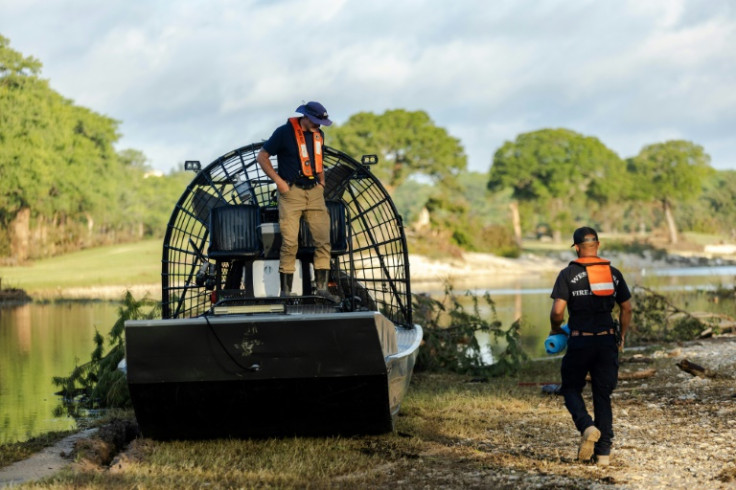 A search and recovery team prepares a fan boat to launch on Guadalupe River in Ingram, Texas