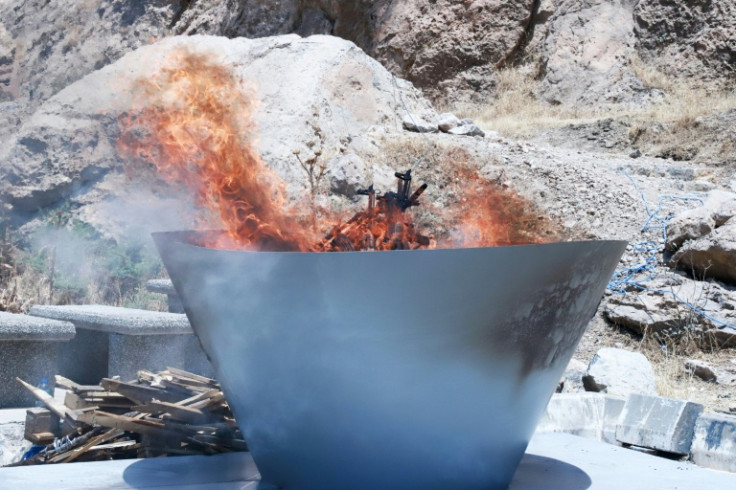A first group of PKK militants burnt their weapons at a symbolic ceremony in northern Iraq
