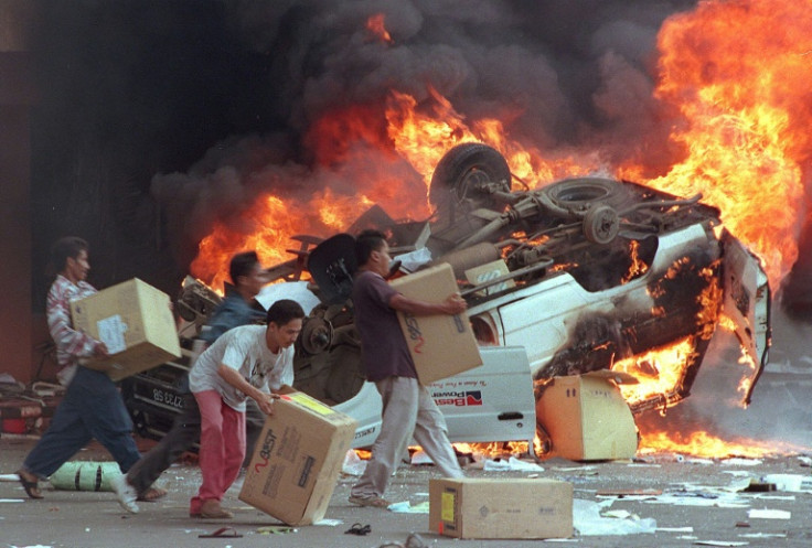 Scholars fear the Indonesian government's plans to issue new history books could be used to cover up past abuses like the 1998 riots targeting mostly ethnic Chinese