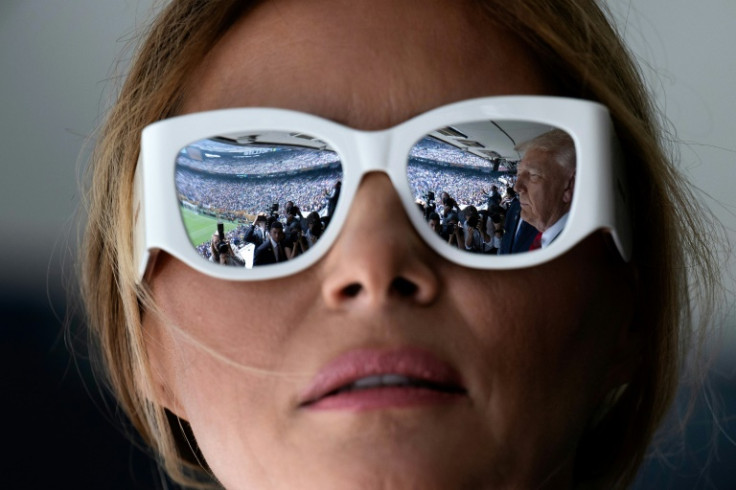 US President Donald Trump is reflected in First Lady Melania Trump's sunglasses