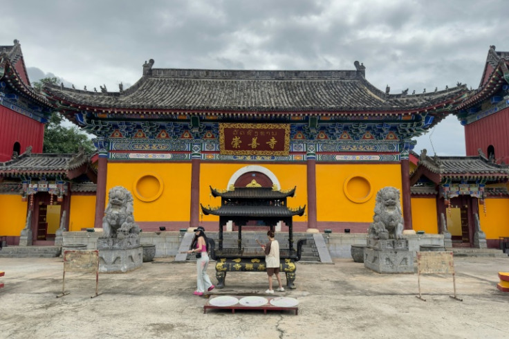 Traffic signs in the GTSEZ are in Chinese script, while everything from cigarettes to jade and fake Christian Dior bags are sold in China's yuan