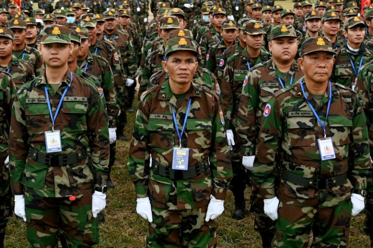Soldiers stand in formation during a ceremony marking the 25th anniversary of the formation of the Royal Cambodian Army in Phnom Penh in January 2024. Cambodia will next year activate a long-dormant law requiring citizens aged 18 to 30 to enlist in the mi