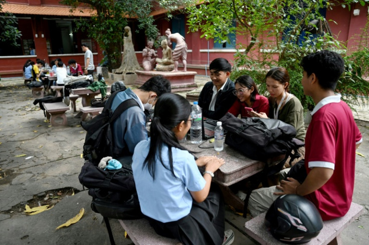 Fine arts students at their school in Phnom Penh. The generation of Cambodians which may find itself in the firing line when the country introduces military conscription is split between quiet pangs of anxiety and proud proclamations of patriotism