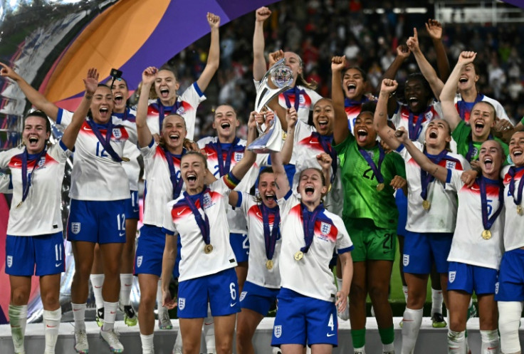 England players lift the trophy after beating Spain on penalties in Sunday's final to win the Women's Euro 2025