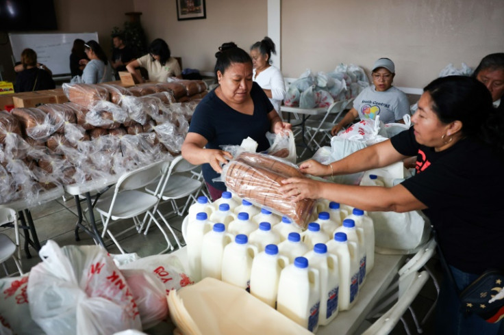 Volunteers pack up food to be taken to undocumented migrants across Los Angeles