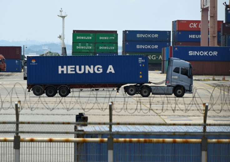 A truck transports a shipping container at a port in Pyeongtaek on July 31. US President Donald Trump said the United States will impose a 15 percent tariff on imports from South Korea