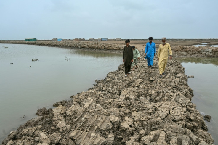 In the town of Keti Bandar, which spreads inland from the water's edge, a white layer of salt crystals covers the ground