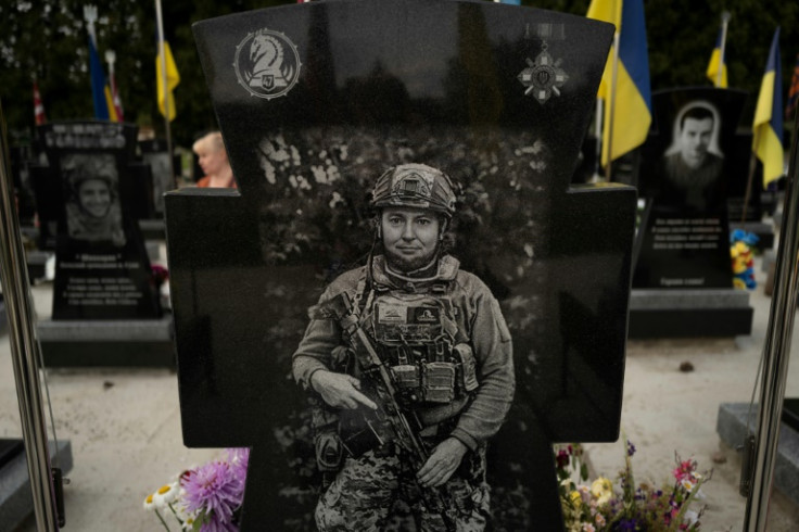 The portrait of a Ukrainian soldier engraved on his gravestone in a cemetery in Sumy