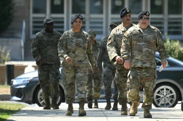 National Guard members stroll through the city
