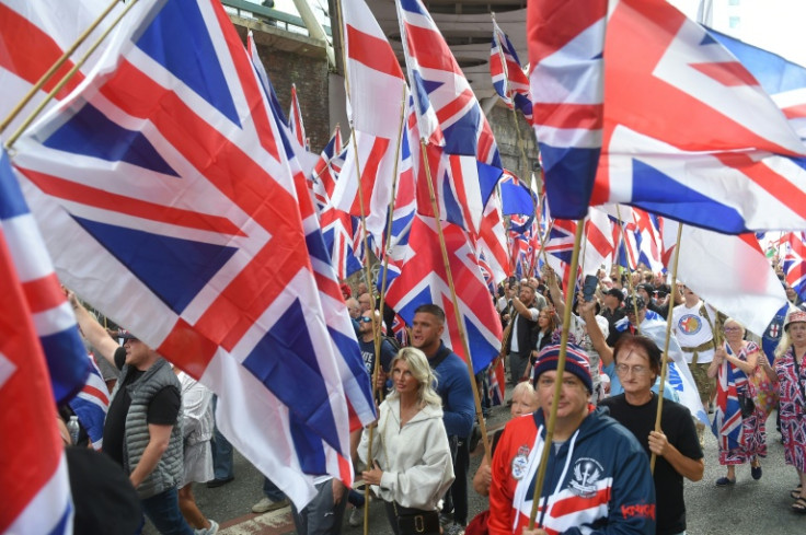Immigration is an explosive issue in Britain, sparking protests on both sides, such as this 'March for Remigration' in Manchester in August calling for mass deportations