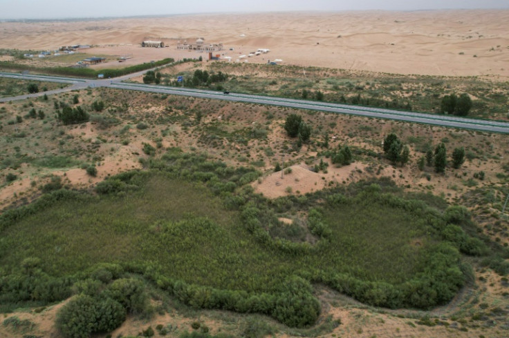 The green zone and the desert landscape in the Kubuqi Desert, in China's northern Inner Mongolia region