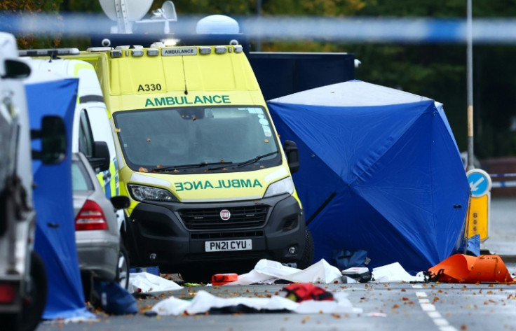 Police tents cover parts of the scene on the main road outside Heaton Park Hebrew Congregation synagogue