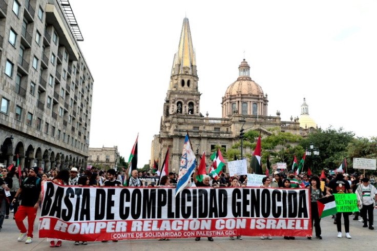 Demonstrators in Mexico display a banner that reads "No more genocidal complicity, break relations with Israel" at a rally Tuesday