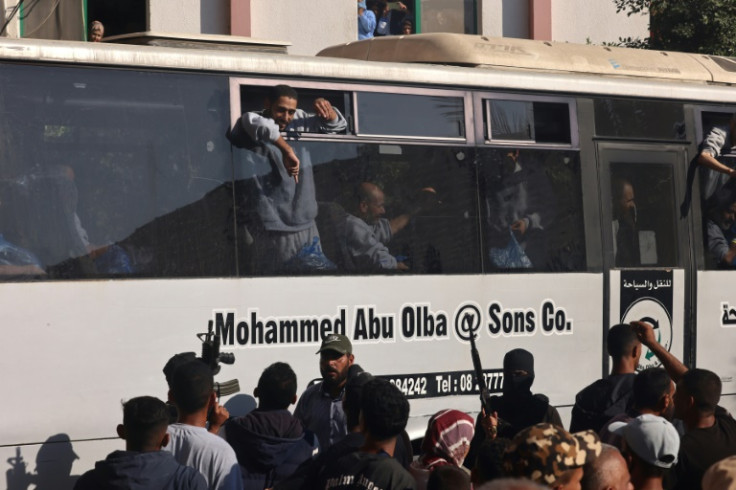 Buses carrying Palestinians released from Israeli prisons under a Gaza ceasefire and hostage exchange deal with Palestinian factions, arrive outside the Nasser hospital in Khan Yunis in the southern Gaza Strip on October 13, 2025.