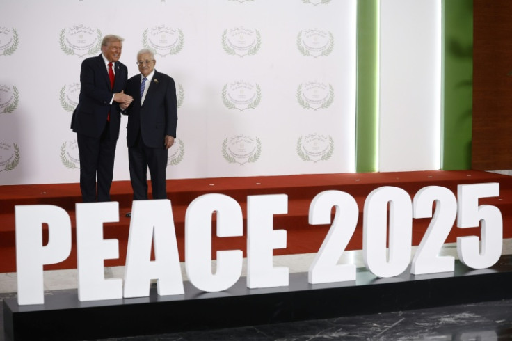 US President Donald Trump greets Palestinian president Mahmud Abbas during a summit on Gaza in Egypt