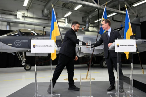 Ukrainian President Volodymyr Zelensky signs a letter of intent with Swedish Prime Minister Ulf Kristersson to get 150 Gripen fighter jets