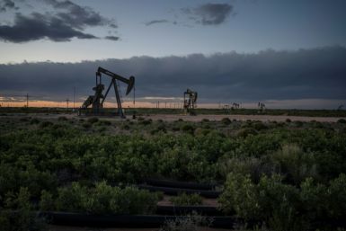 Pump jacks operate at dusk near Loco Hills on April 23, 2020 in Eddy County, New Mexico