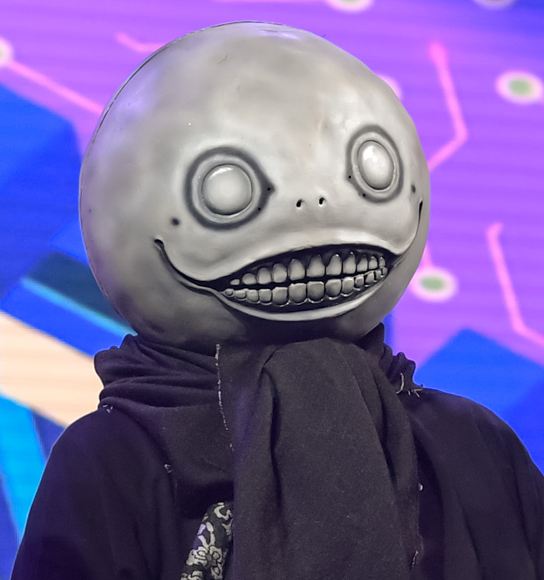 Yoko wearing his familiar mask in 2018