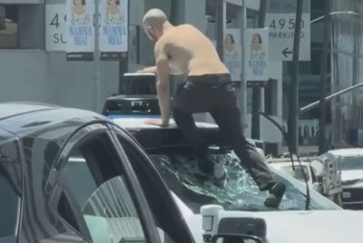Shirtless Man Arrested After Vandalizing Waymo, Halting Traffic in Busy