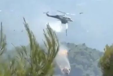 Firefighting Helicopters Collide Near Athens as Greece Battles Wind-Driven Wildfires,