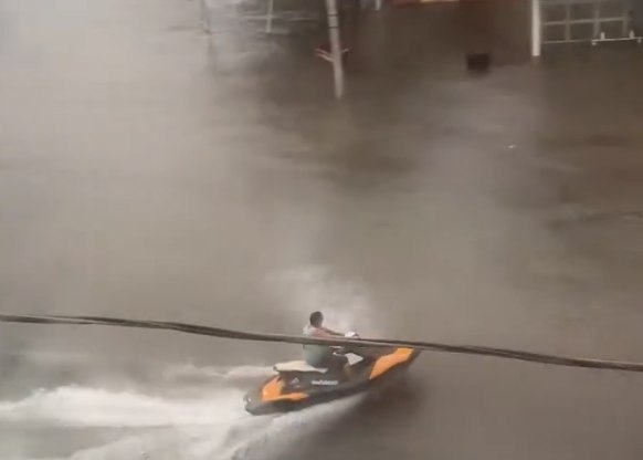Norfolk Business Owner Rides Jet Ski Through Flooded Streets After 