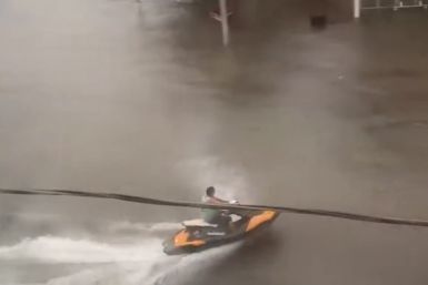 Norfolk Business Owner Rides Jet Ski Through Flooded Streets After