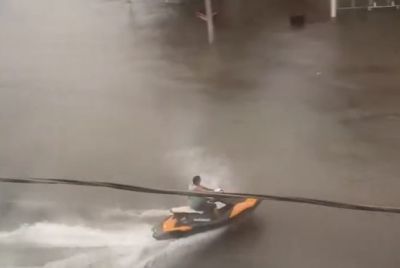 Norfolk Business Owner Rides Jet Ski Through Flooded Streets After