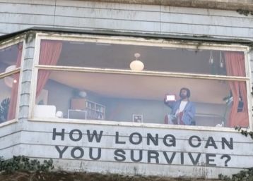 Man Spotted Living Inside Furnished Billboard on Sunset Boulevard for