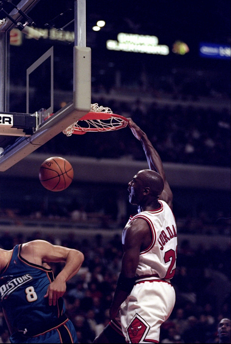 Michael Jordan of the Chicago Bulls (right) in action forward Brian Williams of the Detroit Pistons