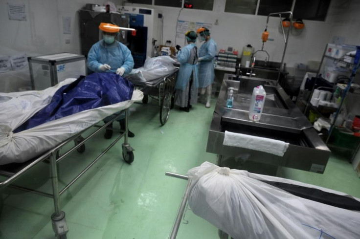 Every body that arrives at the morgue has to be swabbed for Covid-19 by staff swathed in head-to-toe protective suits and face masks and shields