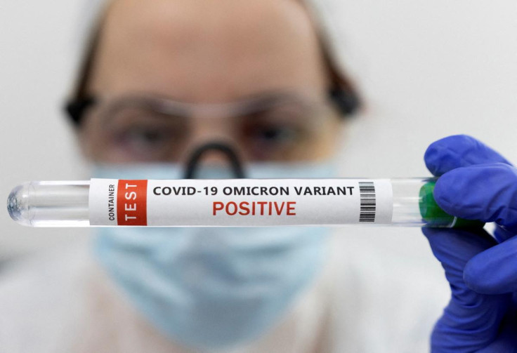 Illustration shows test tube labelled "COVID-19 Omicron variant test positive