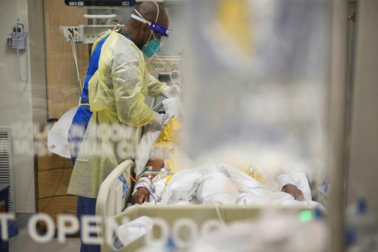 Nurses wearing personal protective equipment (PPE) attend to patients in a Covid-19 intensive care unit at Martin Luther King Jr. Community Hospital on January 6, 2021 in the Willowbrook neighborhood of Los Angeles, California