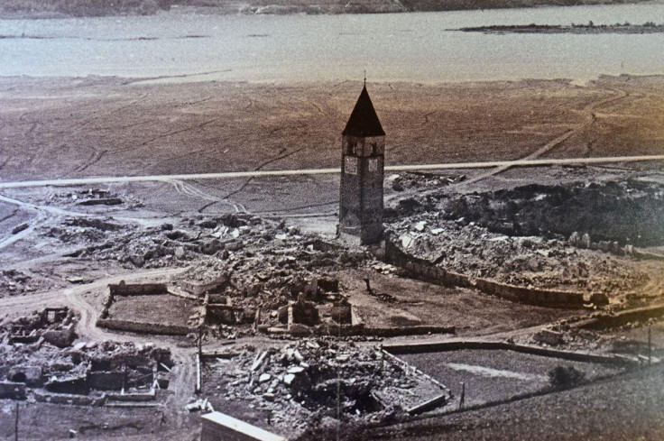Curon's old city bell tower as it was before being submerged in the lake Resia in Italy