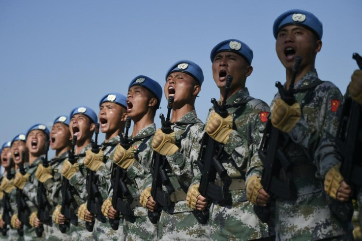 Chinese troops take part in marching drills ahead of an October 1 military parade to celebrate the 70th anniversary of the founding of the People's Republic of China